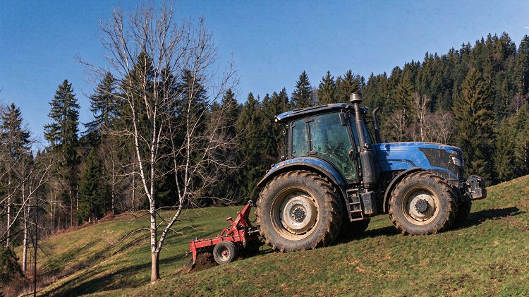 Woye WY2604 tractor working on uneven agricultural terrain Woye WY2604 tractor working on uneven agricultural terrain